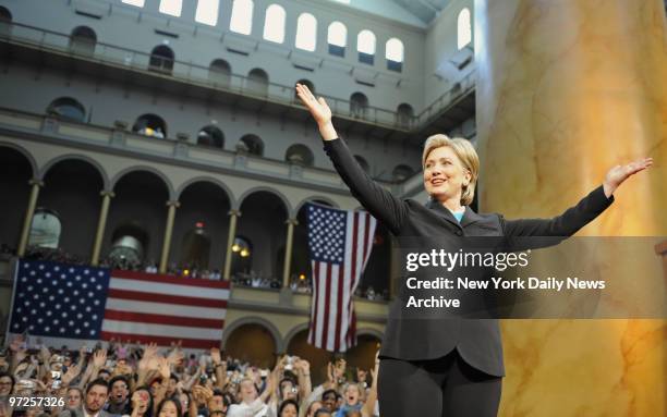 Hillary Rodham Clinton with arms spread before she addresses the crowd to end her campaign for president of the United States and giving her...