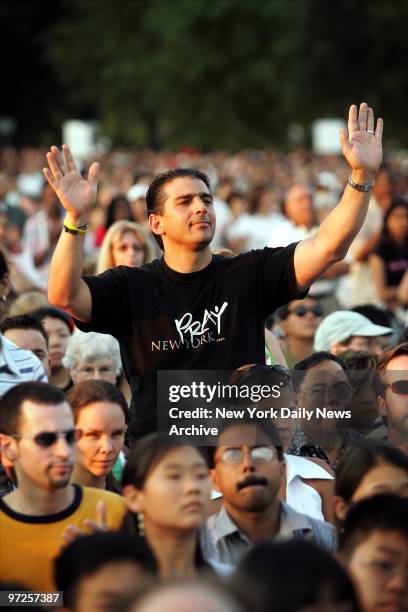 Chris Paulucci of Staten Island is among a large crowd attending the first night of the Greater New York Billy Graham Crusade at Flushing...