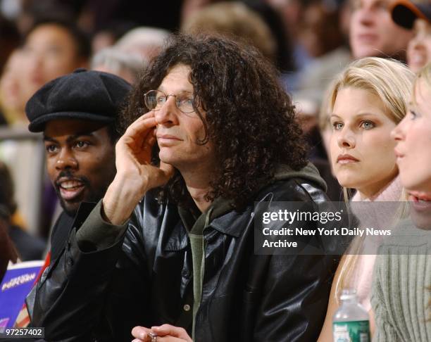 Chris Rock with Howard Stern and girlfriend Beth Ostrosky watch the action as the New York Knicks play the Indiana Pacers at Madison Square Garden.