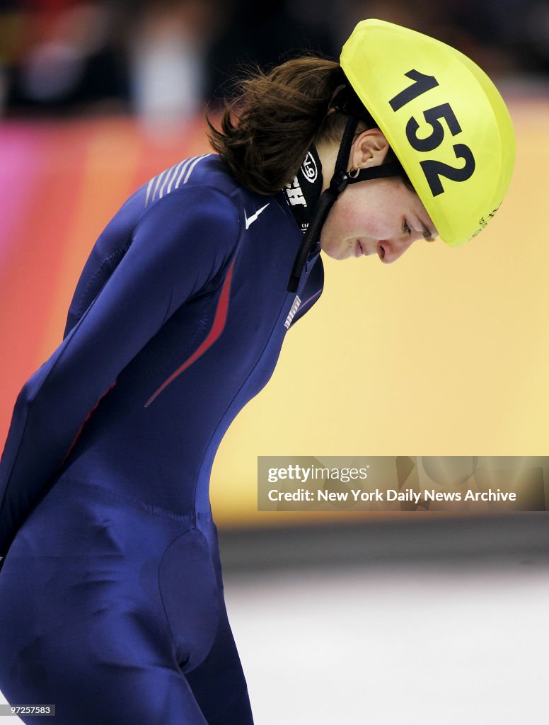 Kimberly Derrick of the U.S. tries to hold back tears as she