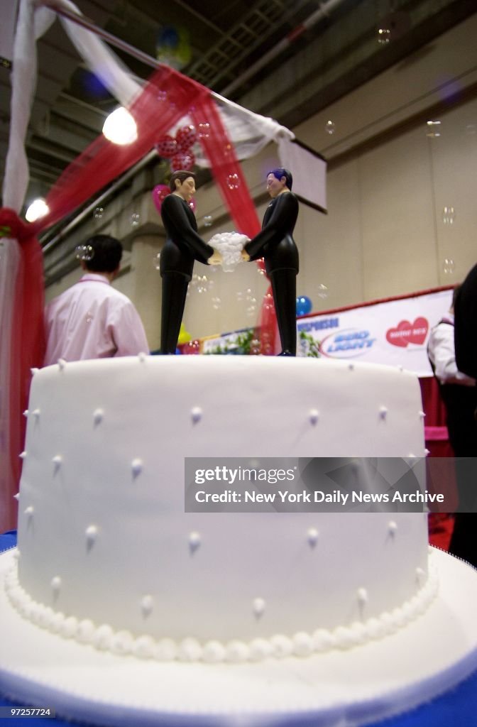 His 'n' his wedding cake toppers from The Knot are on displa