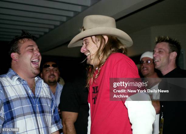 Kid Rock shares a laugh with pal Uncle Kracker at the PlayStation 2 house in Southampton, L.I., for one of many parties this weekend to bid farewell...