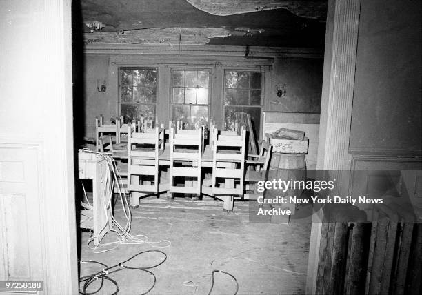 Home of Edith Bouvier Beale in East Hampton, L.I. Chairs are placed atop table of dining room.