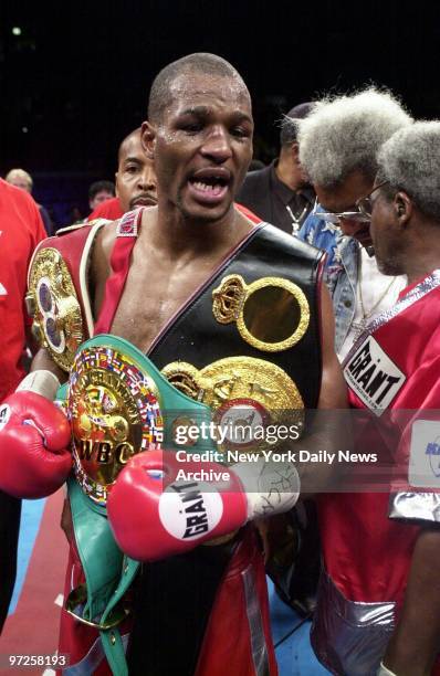 Bernard Hopkins wears his glittering prizes, including the WBA middleweight championship belt he just took away from Felix Trinidad Jr., in their...