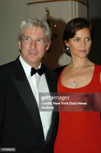 Honorees Richard Gere and wife Carey Lowell are at the Pierre Hotel for the Eighth Red Ball -- The Year's Most Romantic Evening. The Red Ball was...