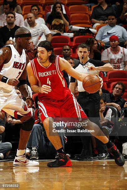 Luis Scola of the Houston Rockets posts up against Jermaine O'Neal of the Miami Heat during the game at American Airlines Arena on February 9, 2010...