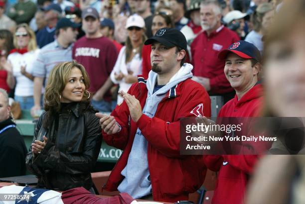 Jennifer Lopez casts an affectionate glance toward beau Ben Affleck at Fenway Park, where the couple was on hand to watch Game 3 of the American...