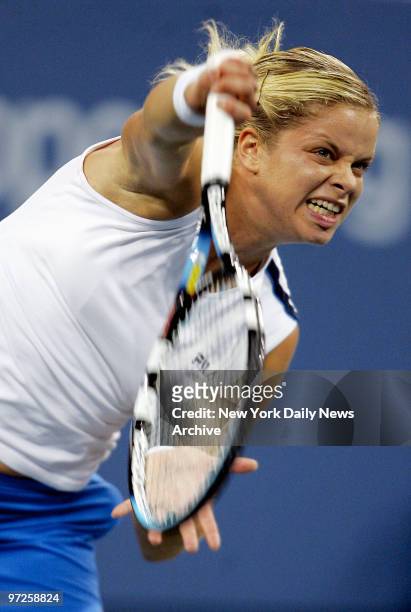 Kim Clijsters of Belgium wears a fierce expression as she serves the ball to Mary Pierce of France during the U.S. Open women's final match at Arthur...