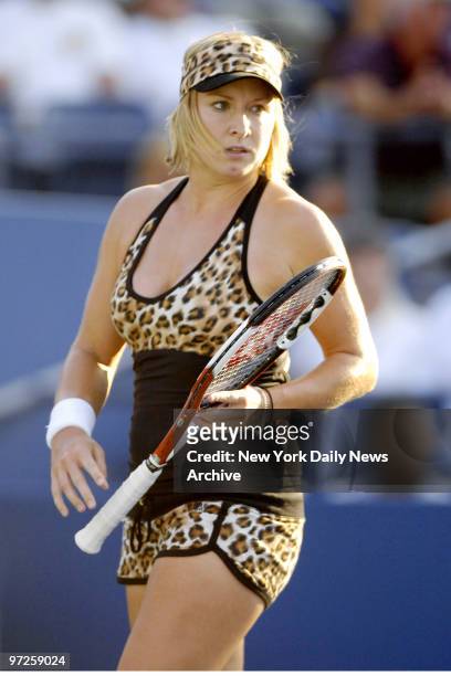 Bethanie Mattek of the United States wears a leopard-print outfit as she plays a doubles match in Louis Armstrong Stadium at the Billie Jean King...
