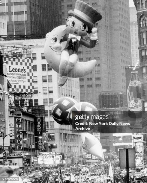 Betty Boop, a new kid on the block, makes her Times Square debut, riding a crescent moon in the Macy's Thanksgiving Day Parade.