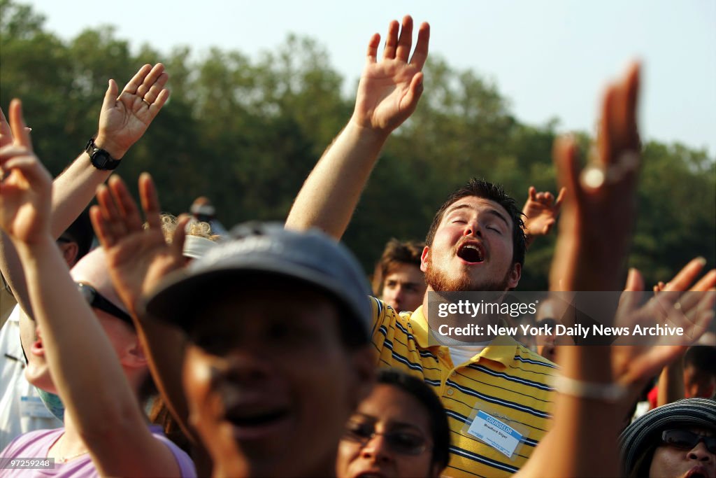 Exultant audience members listen to the Concert of Hope in F