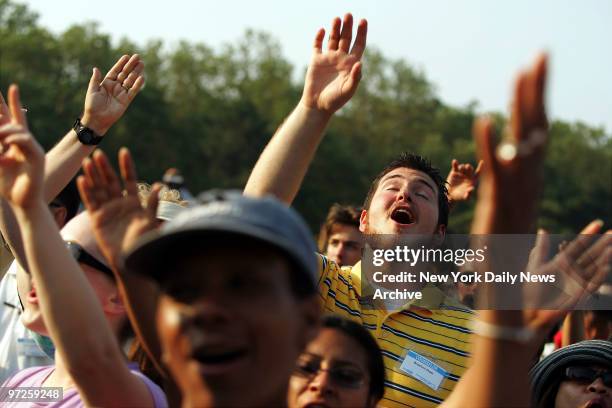 Exultant audience members listen to the Concert of Hope in Flushing Meadows-Corona Park in Queens on the second day of the Greater New York Billy...