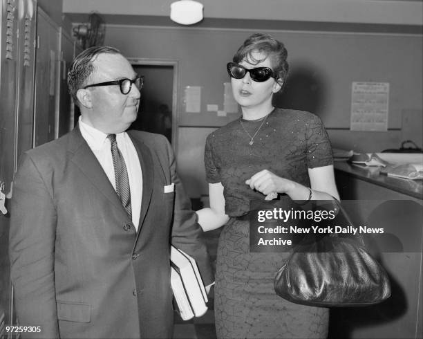 Linda Ris Eyes protected by dark glassses, Linda Riss with Asst. D.A. Alexander ...