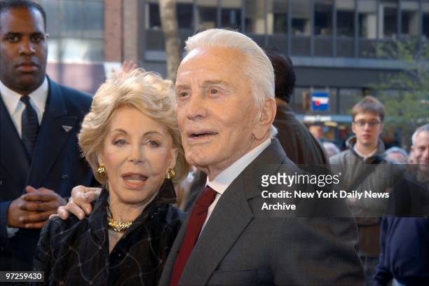 Kirk Douglas and wife Anne Buydens arrive for the premiere of the movie "It Runs in the Family" at the Loews Lincoln Square. He stars in the film...