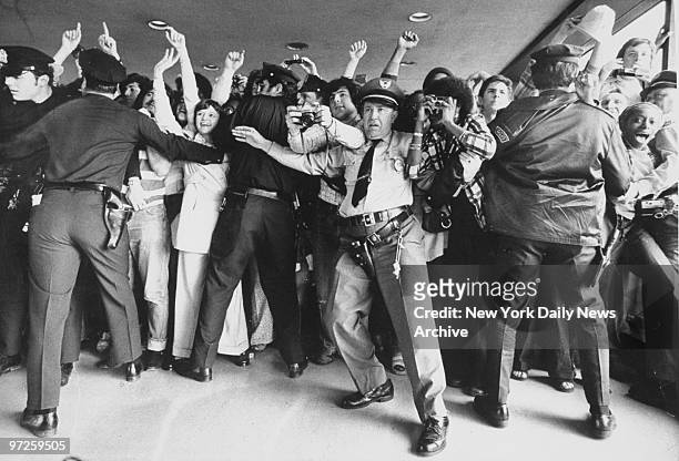 Fans gather at Kennedy Airport to greet the NBA Champion New York Knickerbockers upon their arrival from Los Angeles. ,