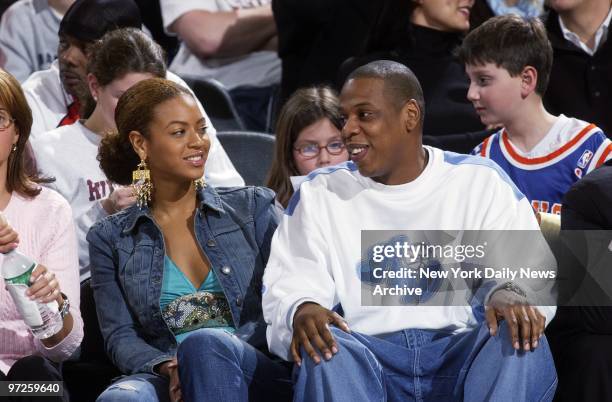 Beyonce Knowles and Jay-Z chat during game between the New York Knicks and the New Jersey Nets at Madison Square Garden. The Nets trounced the...