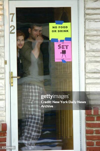 Lake Bell and Colin Farrell look through the doorway of a house on Leggett Place in Whitestone, Queens, where they are filming scenes for their new...