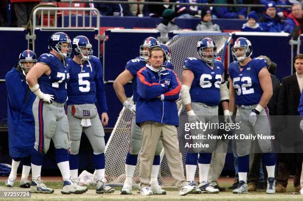Late in second half of game against the Green Bay Packers, New York Giants' head coach Jim Fassel and his team watch from the sidelines as they sense...