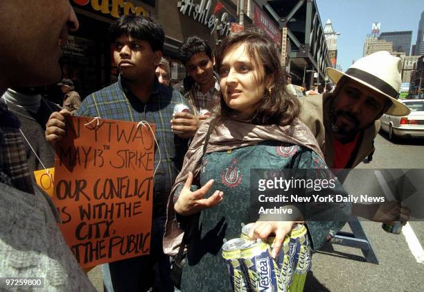 Bhairavi Desai, co-founder and organizer of the New York Taxi Worker's Alliance, speaks to striking drivers outside temporary union headquarters.