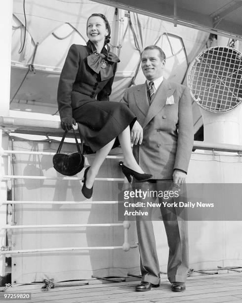 Laurence Olivier and wife Vivien Leigh get view of New York skyline from Mauretania's deck on arrival from England. They are to appear in Olivier's...