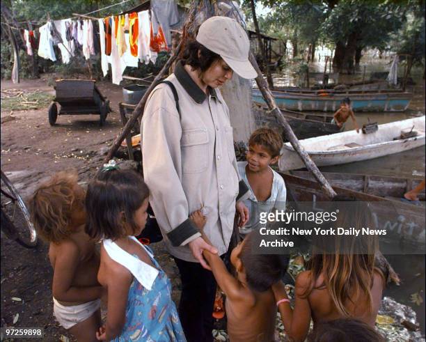 Bianca Jagger greets children now living in their school as a result of floods caused by Hurricane Mitch in Tipitapa, north of Managua, Nicaragua....