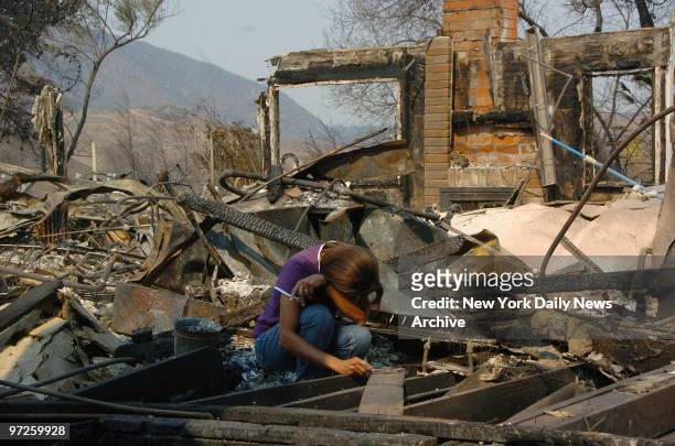 Families come back to find their homes in ruins. Martha Gilmore is and her family are devistated to find their home in runins as she look thru rubble...