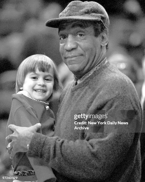 Big East Basketball - Boston College vs. Villanova, Bill Cosby clowns around with 3-year-old Meghan Hataway from Connecticut.