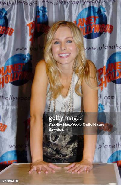 Kristen Bell leaves her hand prints in cement at Planet Hollywood in Times Square during a promotional tour for her new movie "Pulse."