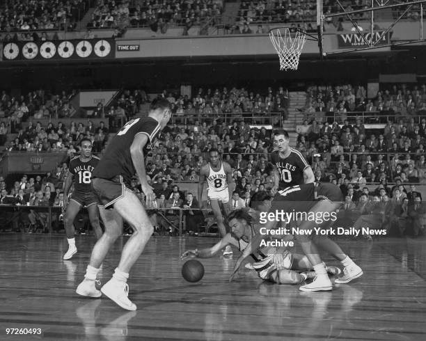 Knickerbockers vs. Baltimore., Although he's down, the Knicks' Gallatin makes a lune at ball after Baltimore's Miller misses on his try. Clifton...