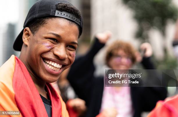 portrait of gay boy with friends having fun on background - youth activist stock pictures, royalty-free photos & images