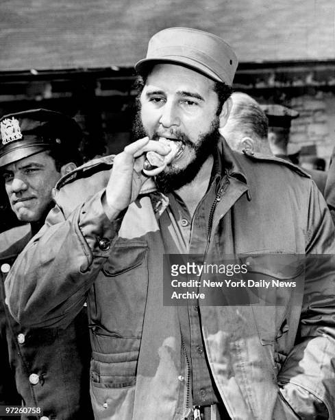 Fidel Castro takes a bite out of a hot dog at the Bronx Zoo.