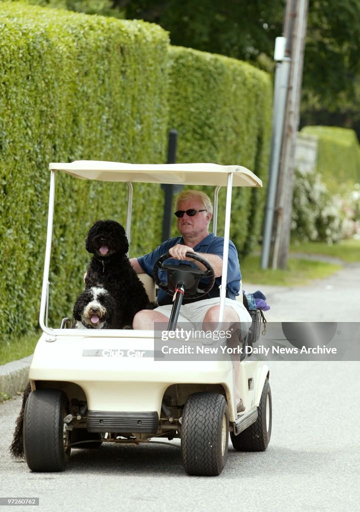 Sen. Edward Kennedy chauffeurs pups Splash and Sunny in a go