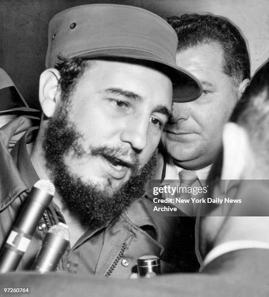 Fidel Castro talks to reporters at Pennsylvania Station before boarding train for Boston, Mass.