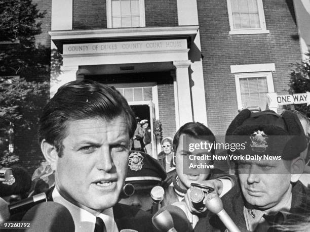Sen. Edward Kennedy talks to reporters after leaving courthouse in Edgartown, Mass., following inquest into the death of Mary Jo Kopechne, who...