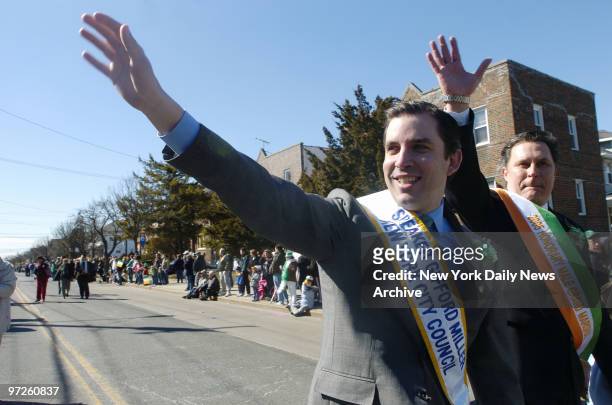 City Council Speaker Gifford Miller waves to onlookers as he marches along Newport Ave. During Rockaway Beach's 30th annual James Conway Sullivan...