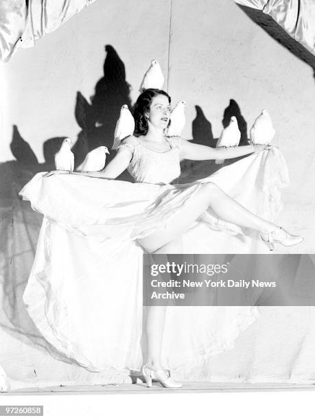 Rosita Royce, the Dove Dancer, does the dance of the "Doves of Peace" at the World's Fair.