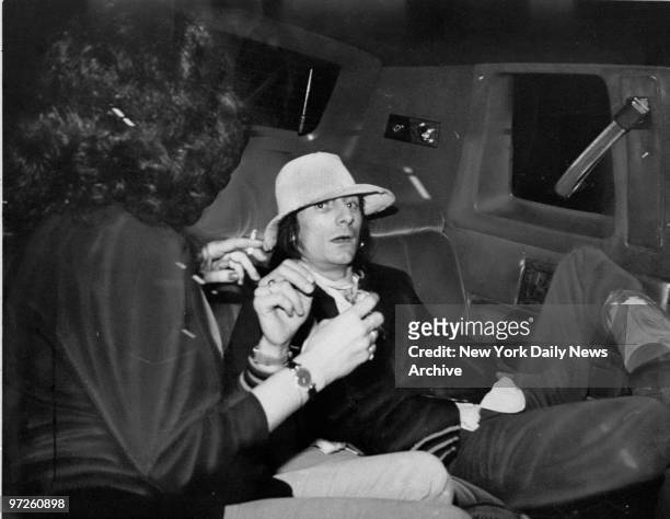 Rolling Stone member Ron Wood, just released from prison in St. Martin, in back of limosine after James Brown concert at Studio 54.