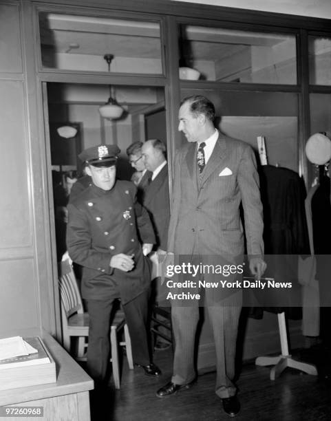 Howard Rushmore leaving the conference room with police as he gets the gate at the Gerhart Eisler, press conference., ENV154870