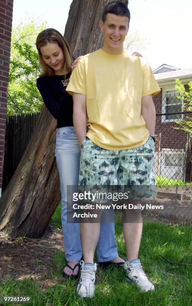 Kristin and Lliam Finn together at their home in Staten Island., Kristin looks at Lliam wearing a pair of board shorts that he bought for himself...