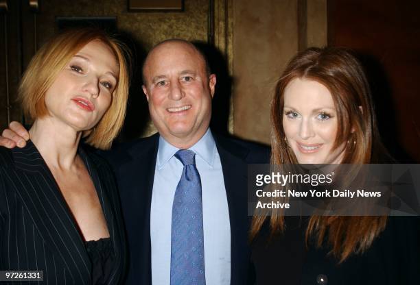 Ron Perelman is flanked by his wife, Ellen Barkin , and actress Julianne Moore at the Revlon 10th anniversary gala for the National Breast Cancer...