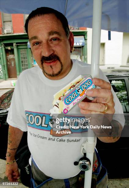 Bill Bray sells Cool Dogs, ice cream sundaes in a sponge cake bun, from a cart on Spring St.