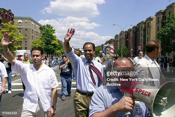 City Councilmen Joel Rivera and Adolfo Carrion Jr. Wave as they march in the Bronx Gay Pride Parade along the Grand Concourse. Carrion Jr. Is running...