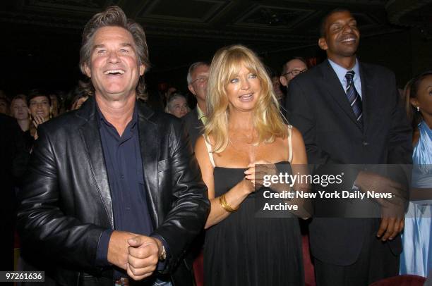 Kurt Russell and Goldie Hawn applaud during the curtain call on the opening night of the Broadway musical "Martin Short: Fame Becomes Me" at the...