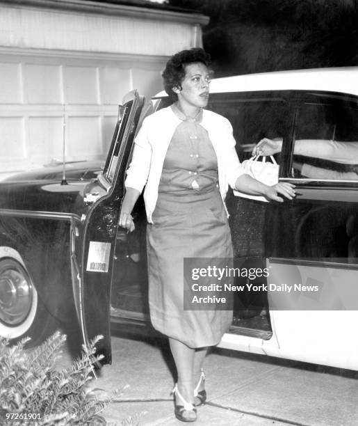 Mrs. Beatrice Weinberger, mother of kidnaped baby Peter leaves car after visit to doctor.