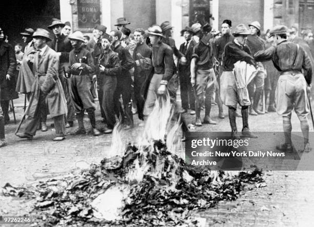 Fascists burn Communist and anti-Nationalist literature seized from a Socialist newspaper.