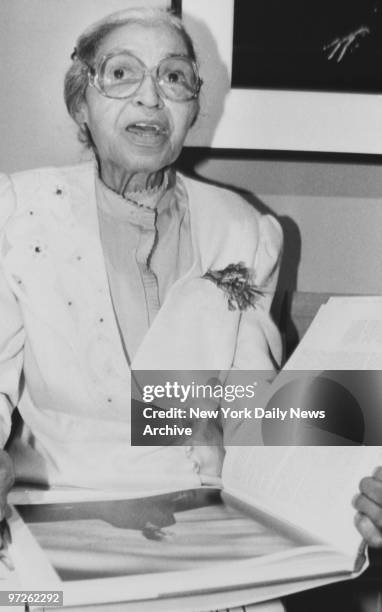 Rosa Parks autographing books.