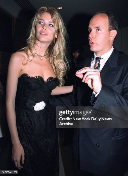 Claudia Schiffer and Prince Albert have a chat at a cocktail party for the World Music Awards.