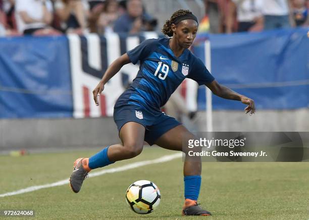 Crystal Dunn of the United States readies to pass the ball in an international friendly soccer match against China at Rio Tinto Stadium on June 7,...