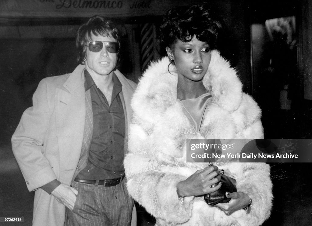 Model Iman with Warren Beatty at Regines disco.