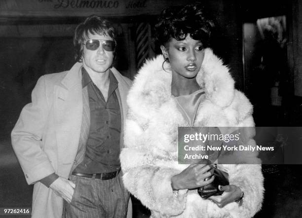 Model Iman with Warren Beatty at Regines disco.